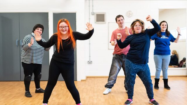 Students dancing in a dance studio at Truro College.