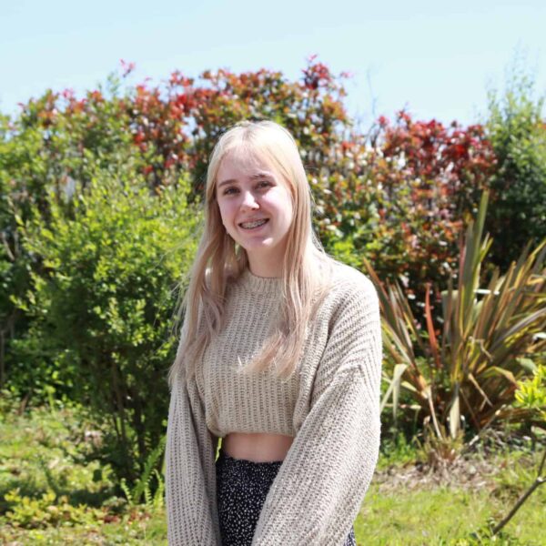 Aimee stood outside on a sunny day.