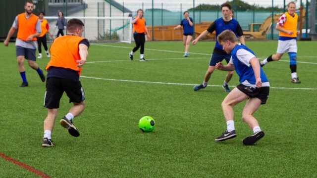 Students playing football.