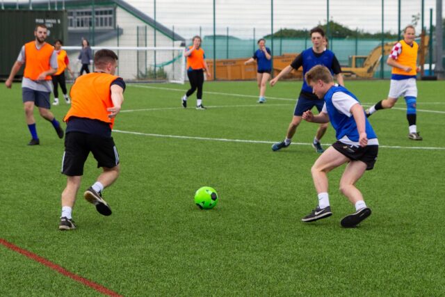 Students playing football.