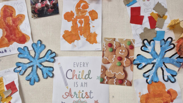 Pictures of gingerbread men which have been painted by children are on a noticeboard. There are also a couple of photos, two snowflakes that have been painted and a sign which says 'every child is an artist'.