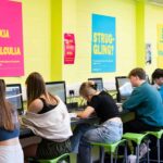 Students work at desks in front of computers in the quiet study area.