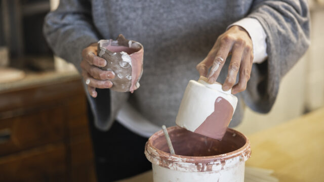Hand making ceramic pottery.