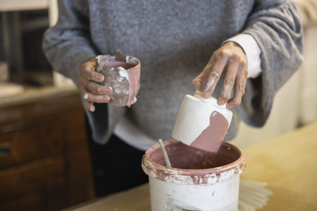 Hand making ceramic pottery.
