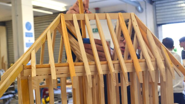 A close up of a small wooden structure.