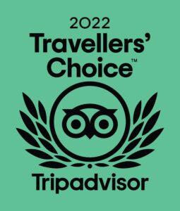 An award logo. The text reads '2022 Travellers' Choice Tripadvisor' and has the tripadvisor logo in the centre.