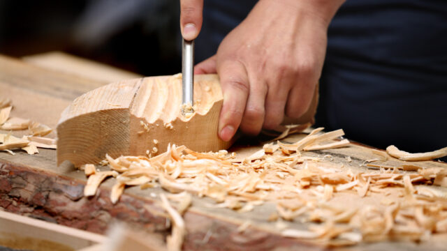 Woodcarver work in the workshop.