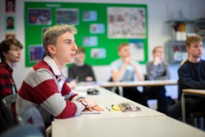 Students sat in a class at Truro College.
