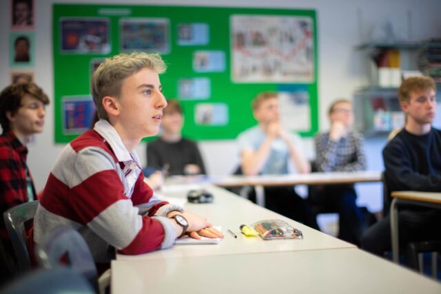 Students sat in a class at Truro College.