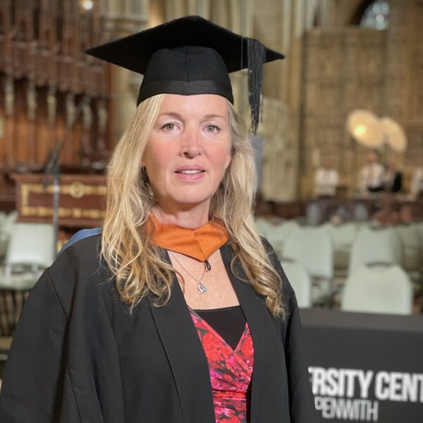 Vanessa in graduation robes.