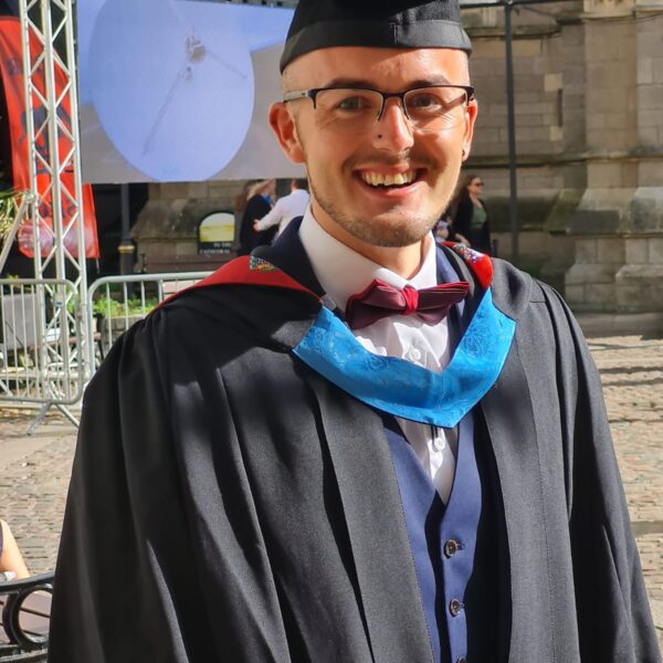 Luke in graduation robes.
