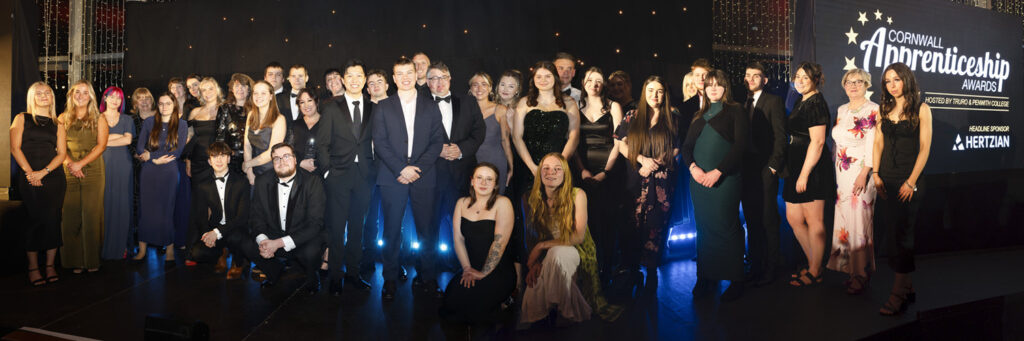 Winners and nominees from the 2025 Cornwall Apprenticeship Awards celebrate on stage.