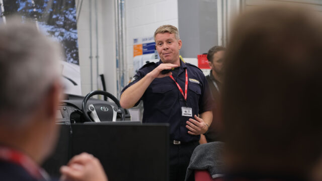 An employer visiting the college giving a talk to current students.