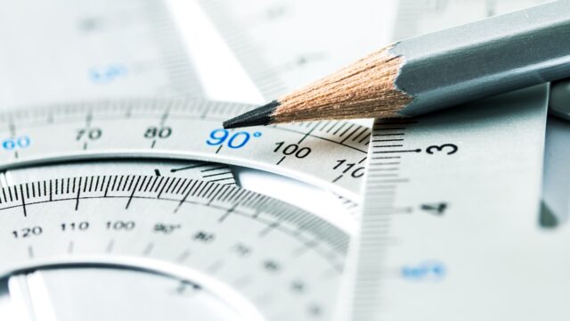 extremely selective focus a part of the silver pencil and precision measurement tool , concept of construction or building design drawing idea