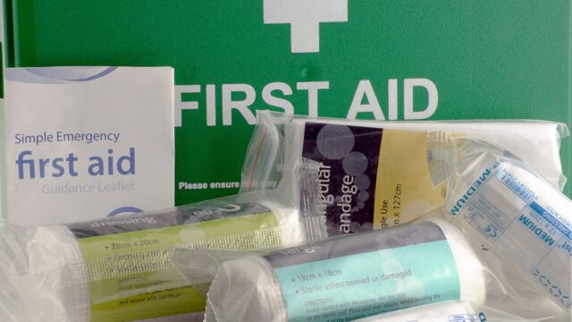 Green first aid box and contents