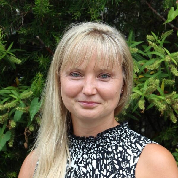 A photo of Vicky Pearson, Vicky is stood outside and is wearing a black and white top.