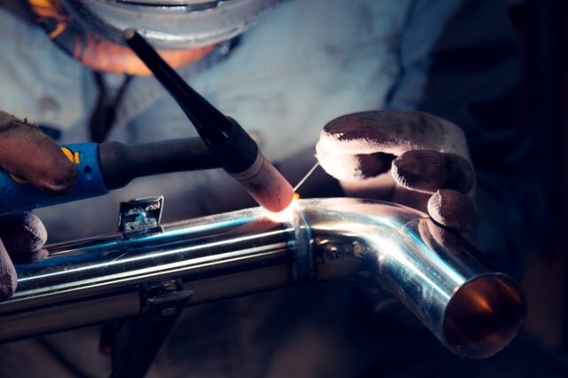 A close up of welding on a metal pipe.