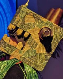 A handcrafted monster head made with recycled materials.