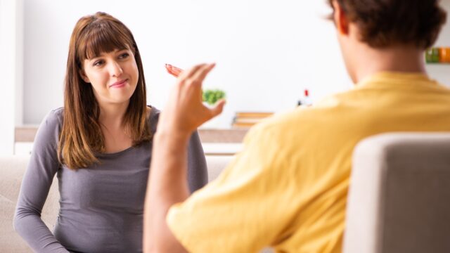 Woman and man learning sign language