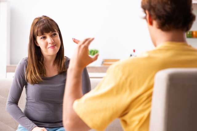 Woman and man learning sign language