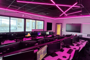 A newly refurbished computer room in Fal with purple lights that are throwing purple colours across the room.