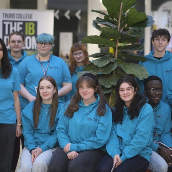 A group of student ambassadors in blue T shirts and hoodies gathered in the Career Zone.