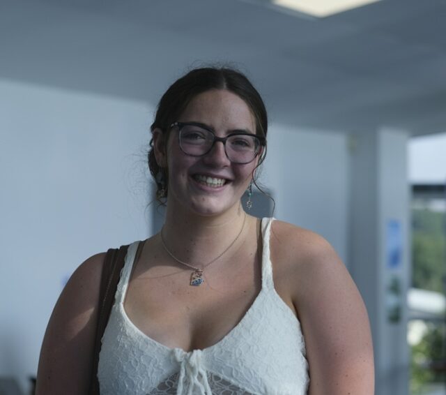 Hermione smiling at the camera on results day.
