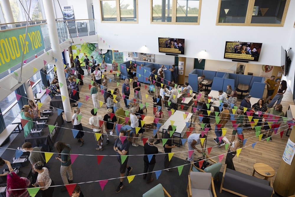 An overhead shot of the Fal food village with colourful bunting, students, parents and teachers.