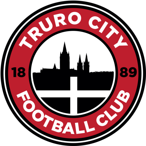 A red circle with Truro City Football Club 1889 written around it. Truro cathedral silhouette in the middle with the cornish flag.