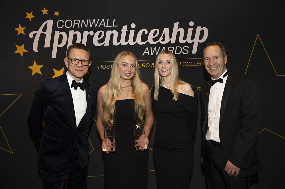 Ella Bardgett holding up trophies on the night of the apprenticeship awards.